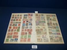 A blue Stock book with eight double pages of well filled stamps of a world mix with a broad range