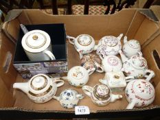 A quantity of Franklin Mint collectors teapots.
