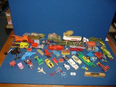 A quantity of Matchbox and Dinky cars, lorries, etc.