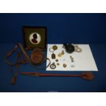 A small quantity of militaria including framed painted silhouette on glass of Wellington,