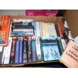 A box of novels including; Lynda La Plante, Wilbursmith, C.S. Lewis Pere Landra, etc.