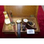 A small quantity of wristwatches and parts in a wooden box and including Seiko, Quartz,