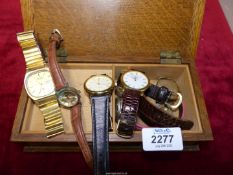 A small quantity of wristwatches and parts in a wooden box and including Seiko, Quartz,