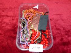 A quantity of costume jewellery including necklaces.