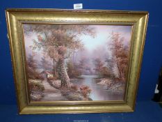 A gilt framed Oil on canvas depicting a river scene with a small cottage on the bank,