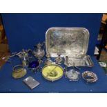 A box of mixed plated ware including tray, claret jug, candlesticks, bread basket, etc.