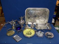 A box of mixed plated ware including tray, claret jug, candlesticks, bread basket, etc.
