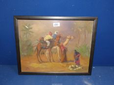 A framed Oil painting of Arabs on camels taking a drink at well indistinctly signed lower left.