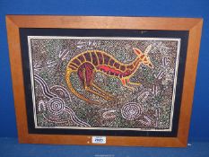 A wooden framed Bulurru Kangaroo hunting Print on fabric by Tjinta Tjinta (Daniel Goodwin).