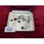 Four pairs of 925 silver earrings set with polished and cut stones plus one odd earring.