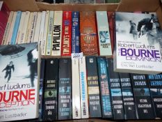 A quantity of paperback novels including; Agatha Christie, Robert Ludlum, Tom Clancy, etc.