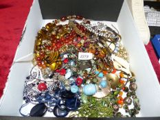 A quantity of costume jewellery including pendants, beads, necklaces etc.