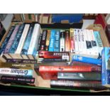 A box of novels to include; Jeffrey Archer, John Grisham, etc.