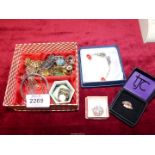 A small quantity of costume jewellery including rings, coin pendants, marked "Pandora",