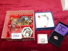 A small quantity of costume jewellery including rings, coin pendants, marked "Pandora",