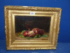 A heavy gilt framed Oil on canvas depicting a Still Life of fruit and wine,