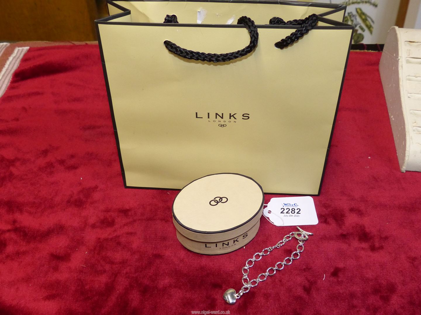 A Links of London 925 'T' bar bracelet with heart charm, cloth pouch, box and gift bag.