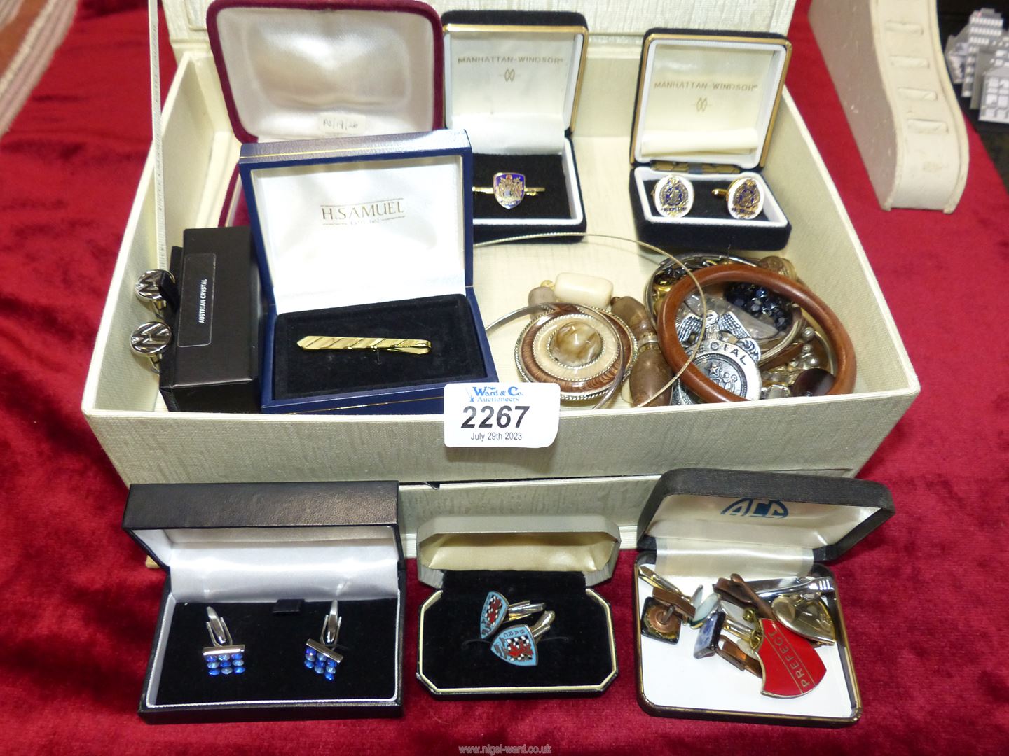 A jewellery box and contents to include cufflinks, clip on earrings, bangles etc.