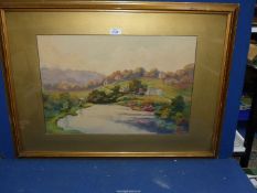 A large framed and mounted watercolour of a countryside landscape,
