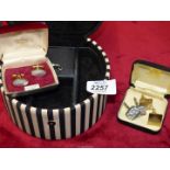 A Thomas Sabo black and white jewellery box and three pairs of cufflinks.