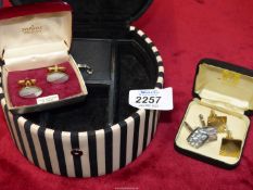 A Thomas Sabo black and white jewellery box and three pairs of cufflinks.