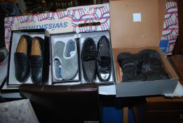 A pair of Lotus size 9 slip-on shoes, work boots, etc.