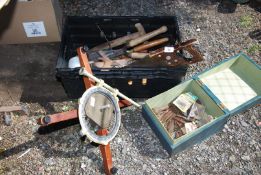 A plastic crate containing a variety of garden and carpentry tools, etc.