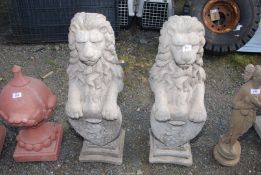Two concrete lions, 32" high.