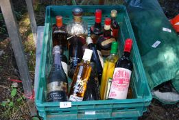A crate of miscellaneous wines, spirits, rape seed oil, etc.