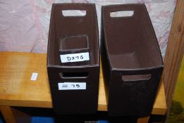 Three leather effect storage boxes.