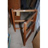 A wooden fold up clothes rail.