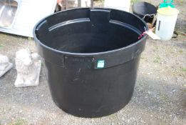 A large black plant pot, 33" wide x 2' high.