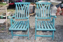 Two fold-up chairs (green).