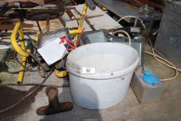 A Halogen work Lamp, 50mm towing ball and a bucket containing various sockets.