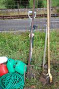 A fork, hand cultivator and a lawn edging spade.