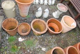 Six terracotta flower pots.
