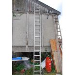 A sixteen rung aluminium extension ladder.