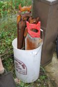 A bucket of wood saws,