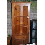 Pine corner cabinet with three shelves, and lower cupboard - 74½" high x 24" wide.