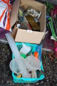 A box containing cupboard handles, locks, funnels and strimmer cords, etc.