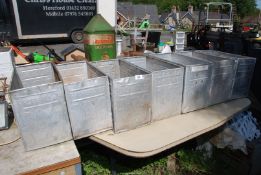 Seven 'Walls' galvanised storage containers.