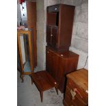 A small table, bedside cabinet, plus two door cabinet.