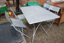 A galvanised table with four chairs - 30" x 47" x 29" high.