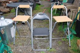Two high stools, and a metal fold-up chair.