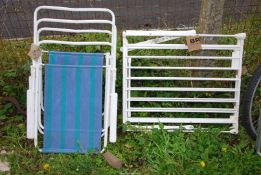 A clothes airer and 2 x fold up garden chairs.