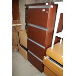Four drawer filing cabinet.