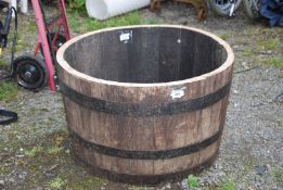 A half-barrel, 25" diameter x 15" high.