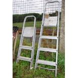 A Four and Three rung Aluminium step Ladders.