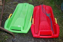 Two Sledges - 1 x green, 1 x Red.