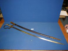A Prussian Wilhelm I Cavalry Sabre with brass stirrup hilt and 83-85cm pipe back blade,